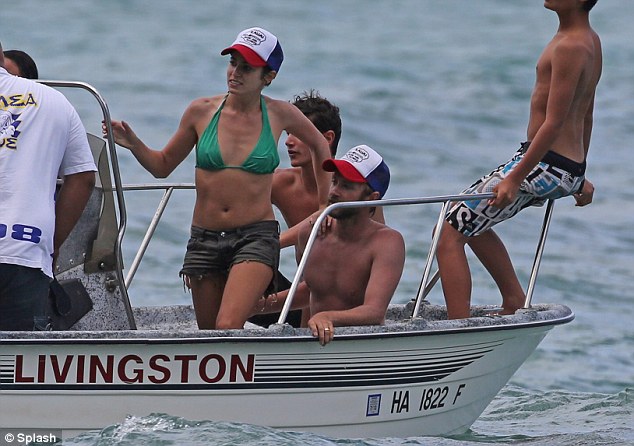 Action girl: Nikki joined Paul and their friends for a boat trip