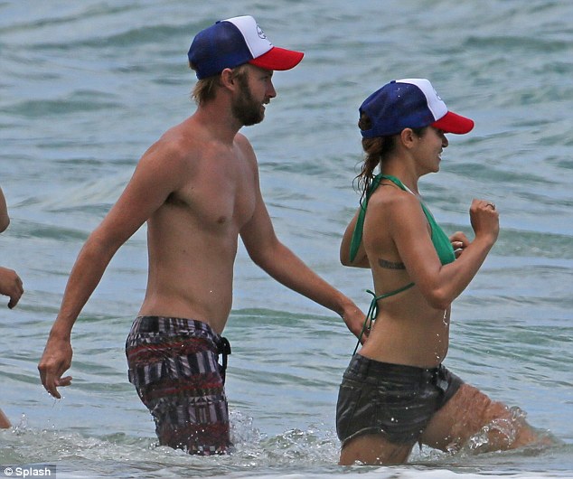 Matching hats: Nikki and Paul are so in love they even dress alike