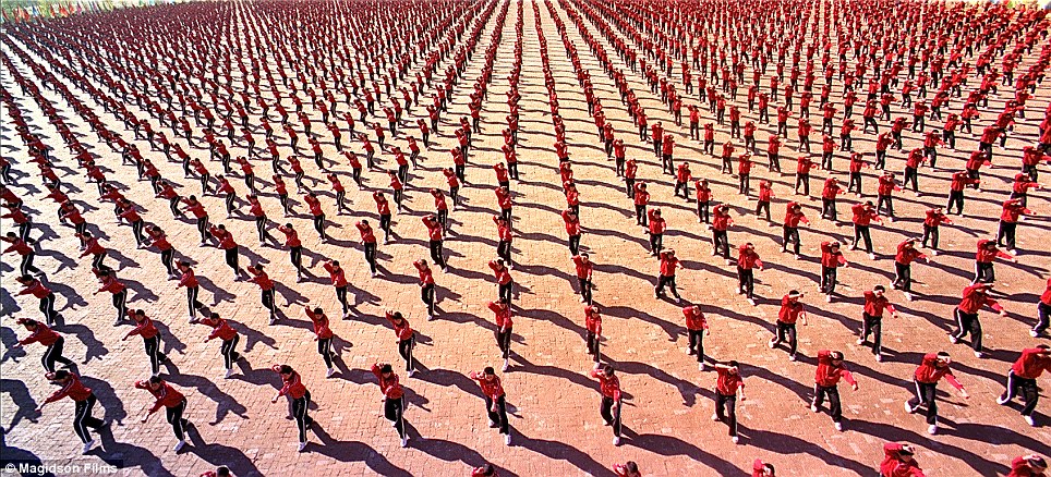Discipline: Hundreds of students demonstrate their moves at the Tagou Wushu Academy in Zhengzhou, China