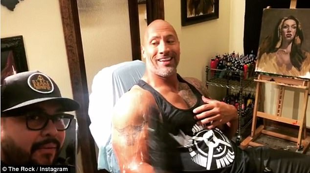 The Rock shared a video of himself getting prepped for his new tattoo; seen with tattoo artist Nikko Hurtado