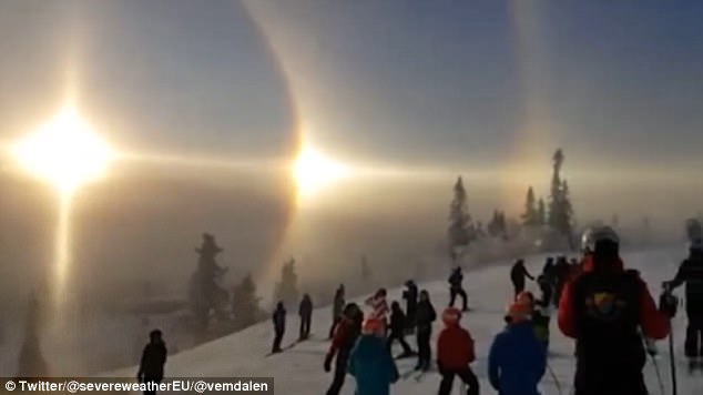 The breathtaking clip was captured by skiers at the Vemdalen resort in central Sweden. The atmospheric effect enveloped the low winter sun with a corona, known as a 22 degree halo