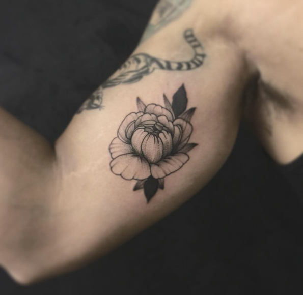 Nice little peony on bicep by Sarb