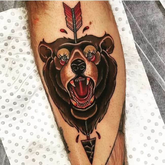 bear on arm with arrow