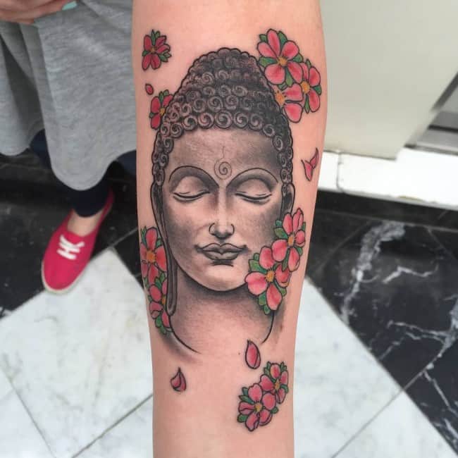 buddha tattoo on single arm
